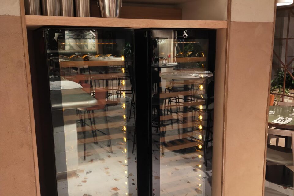 The two glass-door commercial wine display refrigerators at Noci, Battersea